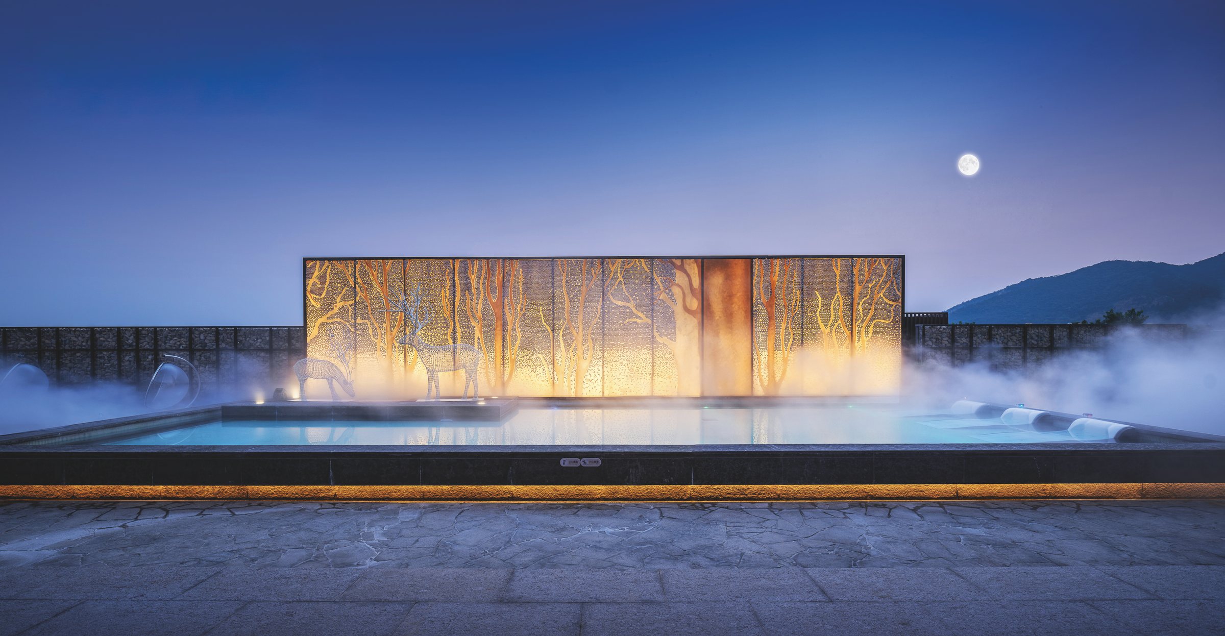 Illuminated thermal-water pavilion at Chunzhigu